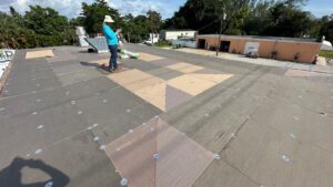 Flat roof replacement/ repairs with insulation in order to create Slope over flat area