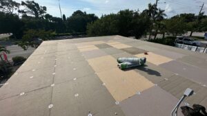 Flat roof replacement/ repairs with insulation in order to create Slope over flat area