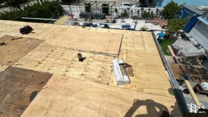 Flat roof replacement/ repairs with insulation in order to create Slope over flat area