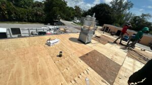 Flat roof replacement/ repairs with insulation in order to create Slope over flat area