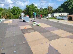 Flat roof replacement/ repairs with insulation in order to create Slope over flat area