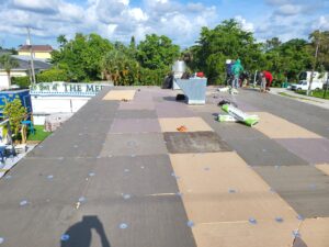 Flat roof replacement/ repairs with insulation in order to create Slope over flat area