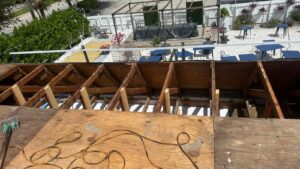 Flat roof replacement/ repairs with insulation in order to create Slope over flat area