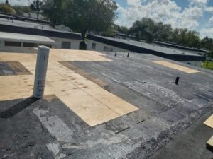 Flat roof replacement with taped insulation in order to create Slope