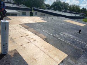 Flat roof replacement with taped insulation in order to create Slope
