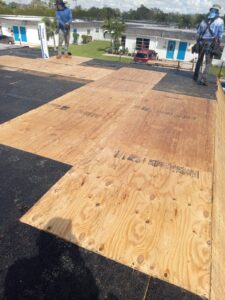 Flat roof replacement with taped insulation in order to create Slope