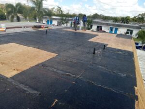 Flat roof replacement with taped insulation in order to create Slope