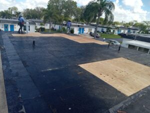 Flat roof replacement with taped insulation in order to create Slope