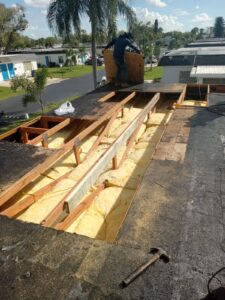 Flat roof replacement with taped insulation in order to create Slope