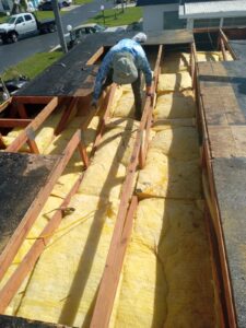 Flat roof replacement with taped insulation in order to create Slope