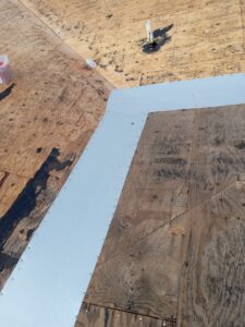 Flat roof replacement with taped insulation in order to create Slope