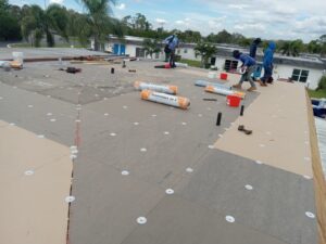 Flat roof replacement with taped insulation in order to create Slope